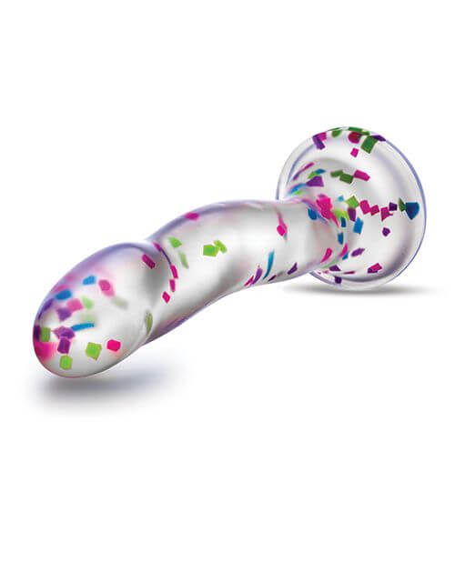 The Blush Neo Hanky Panky dildo lays on its side. The confetti design is really vibrant and striking compared to the translucent dildo material. | Kinkly Shop