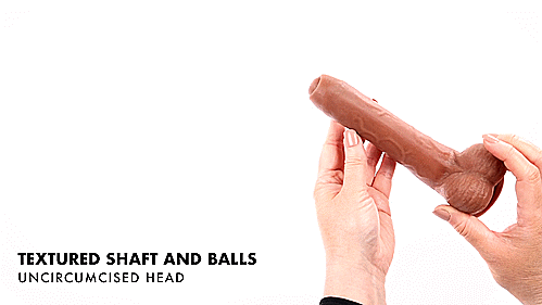 A GIF. A person handles the Evolved Peek a Boo Vibrating Dildo in front of a camera lens. They squeeze the balls, which squeeze easily under pressure before turning the dildo over. The text on the GIF reads "Textured shaft and balls. Uncircumsized head." | Kinkly Shop