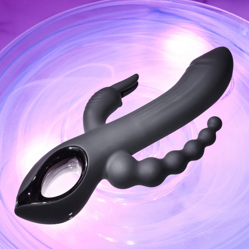 The Evolved Trifecta in front of a bright, colorful purple background. The purple swirls behind the vibrator. | Kinkly Shop