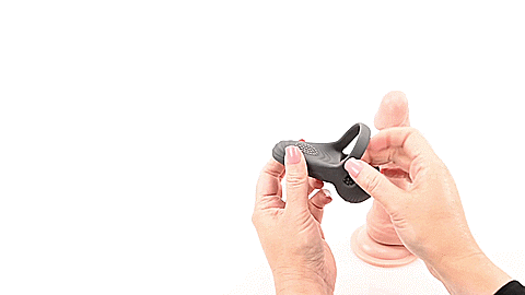 GIF shows a person handling the Evolved Undercarriage. They tug the cock ring portion to showcase how stretchy it is, and then they fold the testicle cups in and out to showcase how movable those flaps are as well. Text on the GIF reads "10 Vibrating Speeds and Functions" | Kinkly Shop