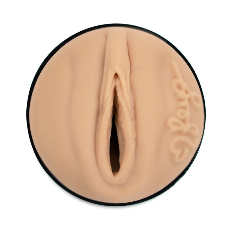 Close-up of the orifice for the entrance of the KIIROO FeelStars FeelReya Stroker. The vulva is molded directly from Reya Sunshine's body. Her signature is also displayed next to the labia. | Kinkly Shop