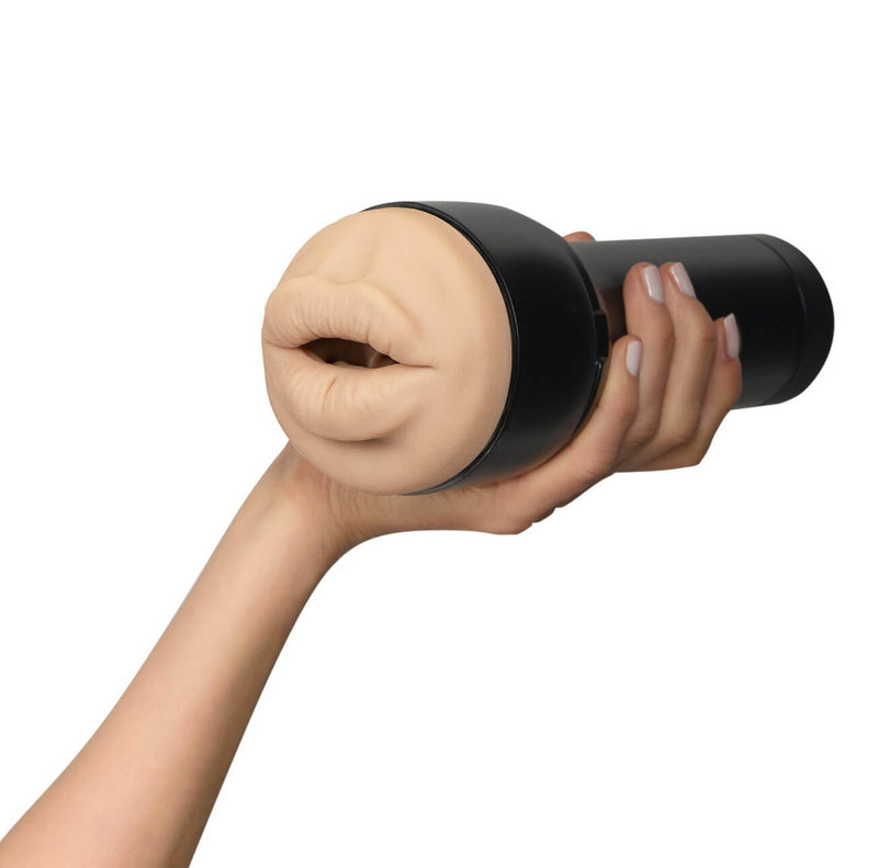 A hand holds the handle of the KIIROO FeelStars FeelVictoria June Mouth stroker. | Kinkly Shop