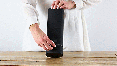 GIF shows a person opening up the charging port on the back of the KIIROO Onyx+ and then plugging in the included charging cable to charge the Onyx+. | Kinkly Shop