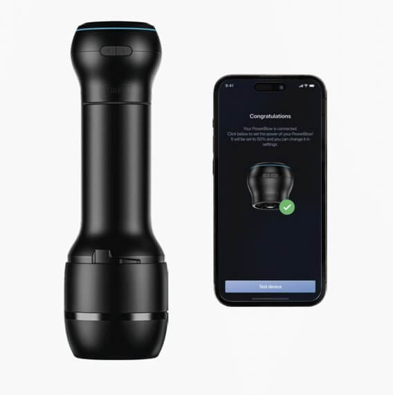 The KIIROO PowerBlow Attachment attached to a KIIROO case. The stroker and the PowerBlow are shown next to a cell phone which has just finished Bluetooth pairing with the KIIROO PowerBlow Attachment for app control. | Kinkly Shop