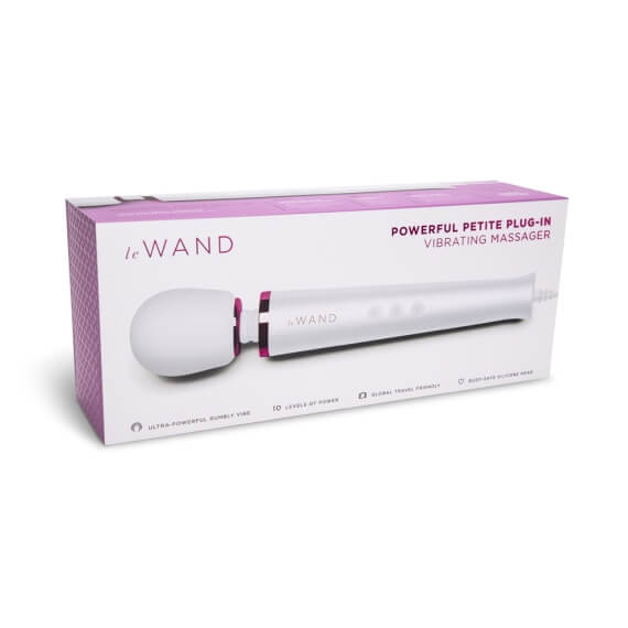Packaging for the Le Wand Petite Plug-In Massager in white. The box is white and purple and rectangular. | Kinkly Shop