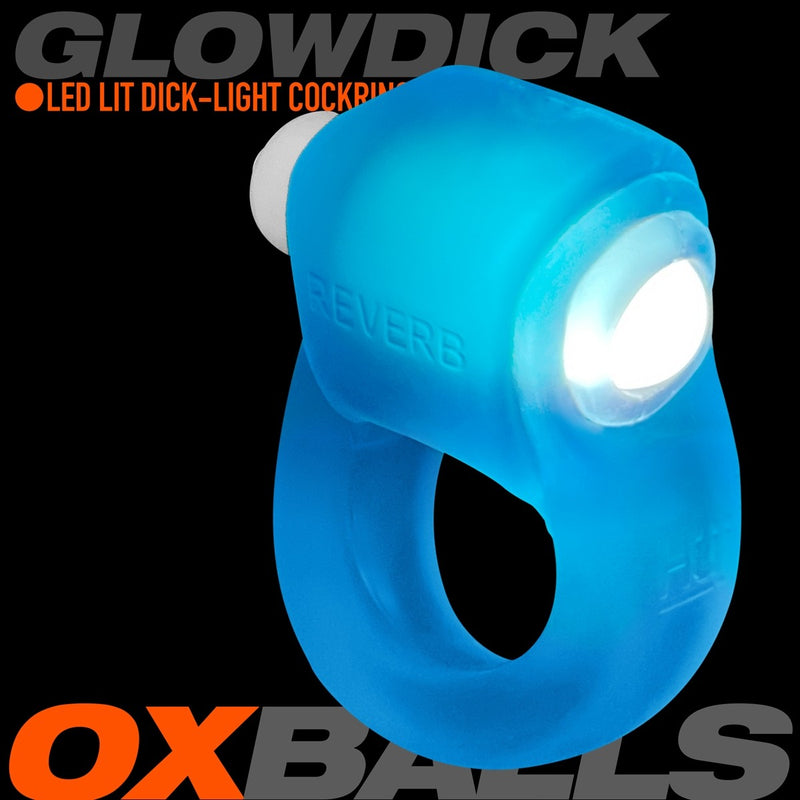 The Oxballs Glowdick in Blue Ice against a black background. The LED light is inserted into the cock ring, and it has a white glow that looks blue with the translucent material of the cock ring. The ring itself looks plushy and stretchy. | Kinkly Shop