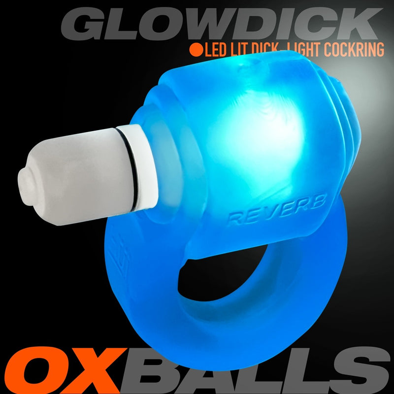 The Oxballs Glowdick in Blue Ice. The LED light is inserted into the cock ring and turned on, showcasing the bright light that the cock ring offers when it's on. It's a cute blue light due to the blue, see-through material of the ring itself. | Kinkly Shop