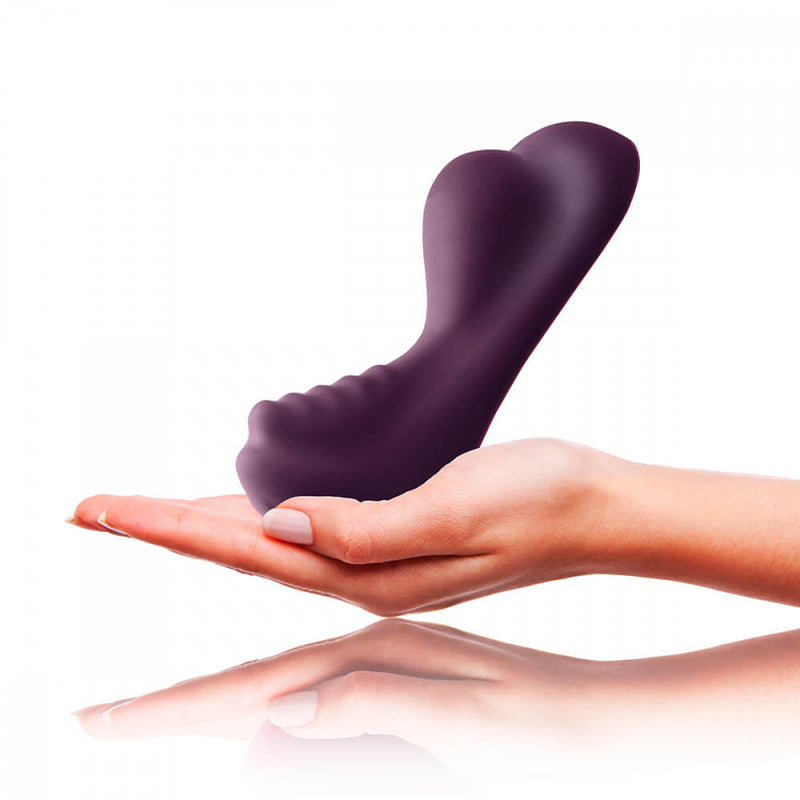 A hand is photoshopped in next to an image of the Rocks-Off Ruby Glow Dusk to show the scale of the vibrator. The vibrator is longer than the person's outstretched hand, and the tallest point is much taller than the width of the person's wrist. | Kinkly Shop