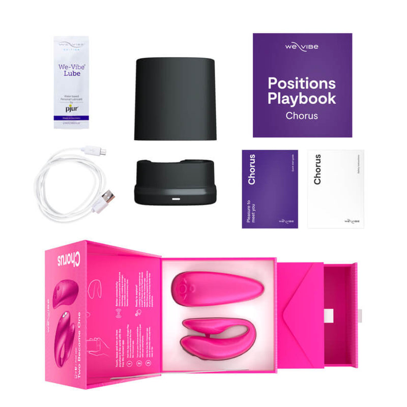 The We-Vibe Chorus with everything that it comes with. The We-Vibe Chorus comes with a positions guide, a sample of lube, the instruction manual, the safety manual, a charging cord, the charging base, and the lid for the charging base. | Kinkly Shop