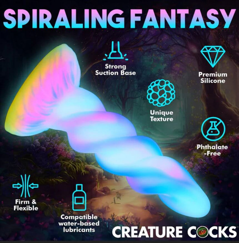 The XR Brands Moon Rider glowing in the dark. Text and icons are displayed around the dildo to showcase the different aspects of the dildo. Text includes: "Spiraling fantasy. Strong suction base. Premium silicone. Unique texture. Phthalate-free. Firm and flexible. Compatible water-based lubricants." | Kinkly Shop