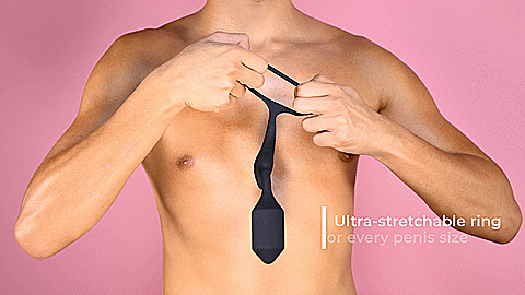 GIF of a person holding the cock ring of the b-Vibe Vibrating Snug and Tug in front of their chest. They pull the ring from both sides to showcase how stretchy the silicone material is. The text on the GIF reads "Ultra-stretchable ring for every penis size" | Kinkly Shop