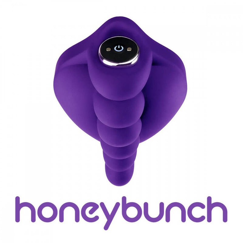 A top-down image of the Honeybunch Dildo Base Attachment for Pegging Pleasure shown with a close-up of how a bullet vibrator would fit into the empty chamber. (No bullet vibrator is included). At the base of the image, the brand's "honeybunch" verbiage is displayed. | Kinkly Shop