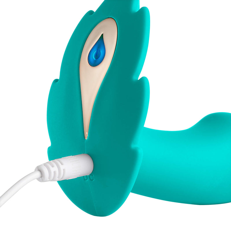 Close-up of the base shows the USB charging cable plugged into the base of Cloud 9 Wireless Remote Control Panty Leaf Vibe. The light for the vibrator is lid up in the Power button. | Kinkly Shop