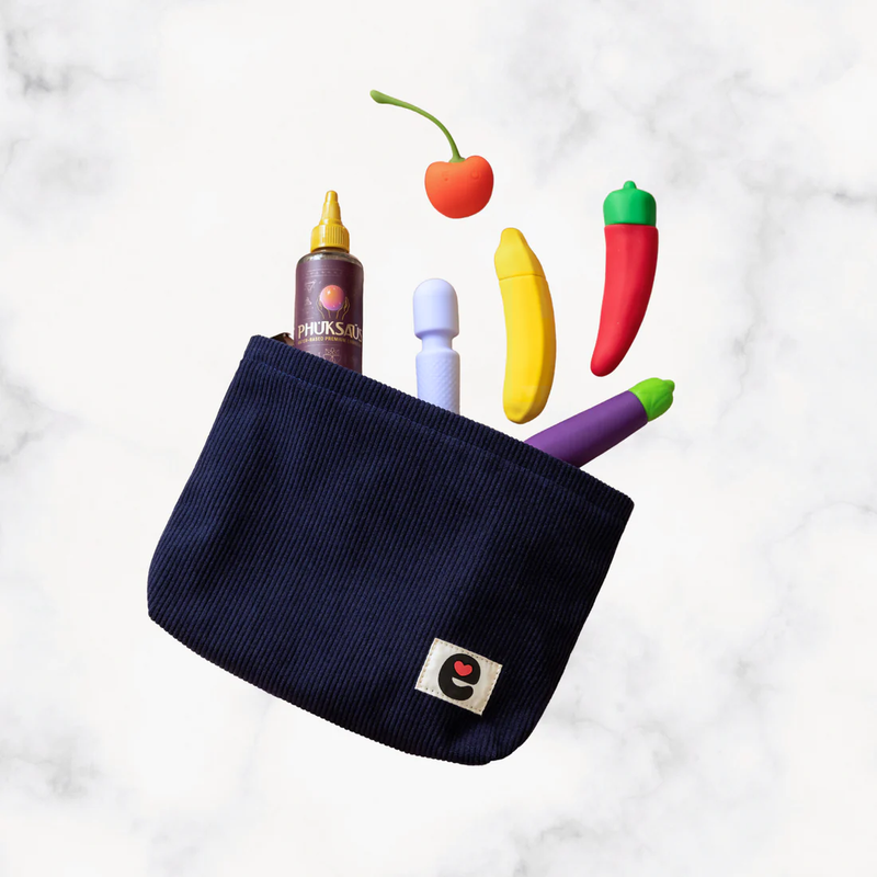 Emojibator Pleasure Pouch against a marbled background, unzipped open. Multiple vibrators are pouring out from the inside of the Emojibator Pleasure Pouch including five vibrators and a bottle of lube. | Kinkly Shop