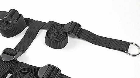 GIF. The straps for the Extreme Under the Bed Restraint System are laid out in a logical fashion that they'd be used in if they were under a mattress. The camera pans from one corner of the strap system to the opposite corner. | Kinkly Shop