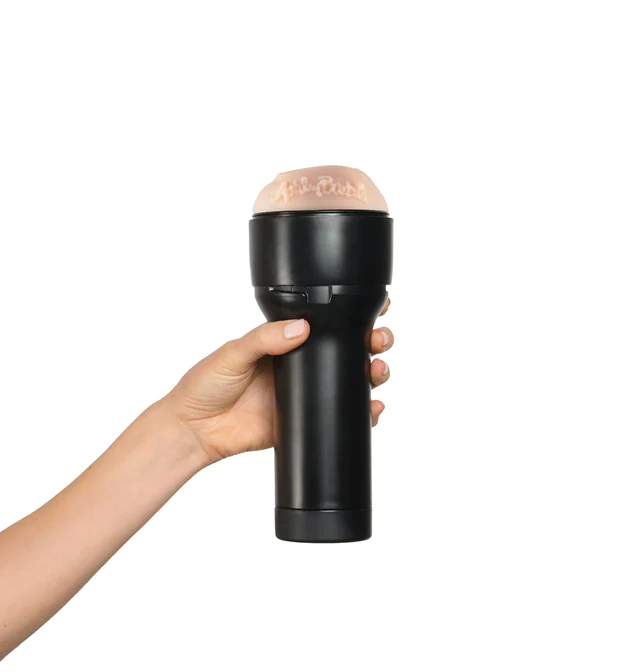 A hand holds the KIIROO FeelStars FeelAshley Stroker. The plastic case fits comfortably into the person's hand. | Kinkly Shop