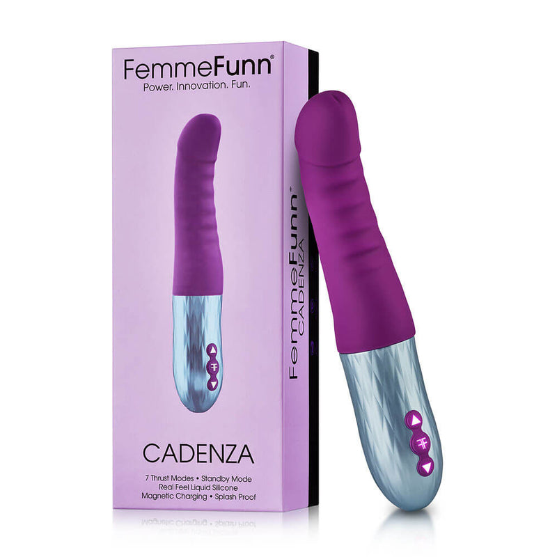The FemmeFunn Cadenza rests up against its packaging. The box is the same color scheme as the purple thrusting dildo. | Kinkly Shop
