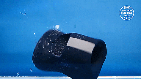 The VeDO Hotrod is dropped into a container full of water in this GIF. The text on the GIF reads "Great for play in Shower or Bath" | Kinkly Shop