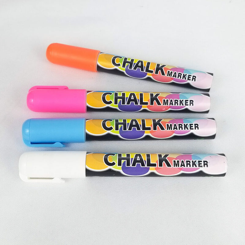 The four included chalk markers with the Chalk Cock. There is an orange/red, pink, light blue, and white color. | Kinkly Shop