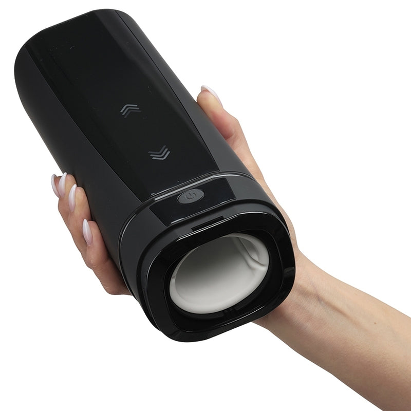 A human hand holding the KIIROO Onyx Plus penis stroking sleeve | Kinkly Shop