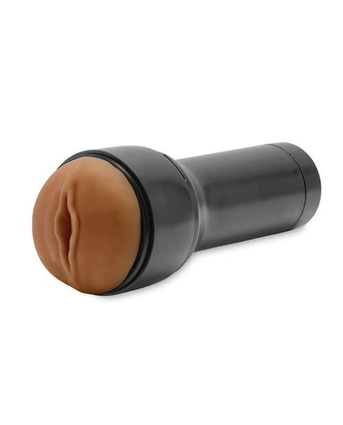 KIIROO RealFeel Generic Vulva in Mid Brown. The stroker is laying at a 3/4ths angle to the camera against a white background. | Kinkly Shop