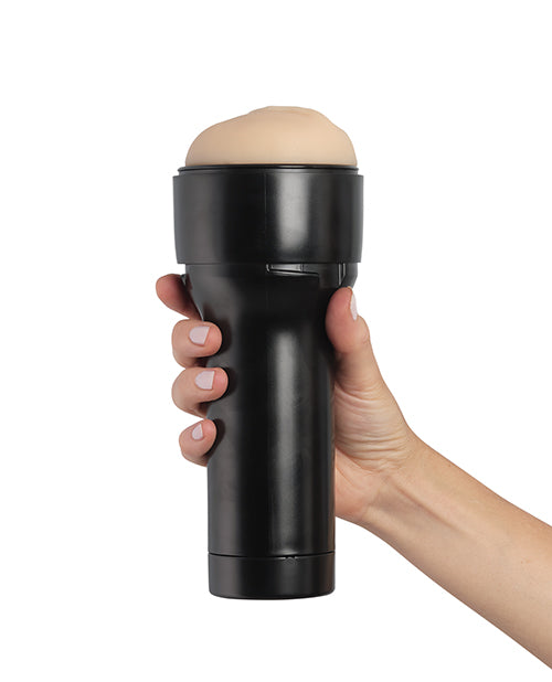 A hand holds the KIIROO RealFeel Original penis stroker case. It looks easily grippable with one hand - but the length of the case means you could fit a second hand on the case if you wanted to. | Kinkly Shop