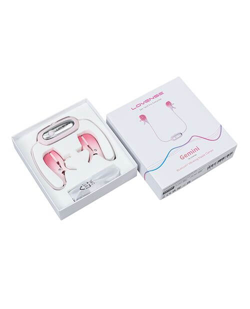 The Lovense Gemini remote control nipple clamps resting within its box. The Lovense Gemini remote control nipple clamps comes in a cardboard box with an internal tray cut specifically to fit the parts of the Gemini safely during transit. | Kinkly Shop
