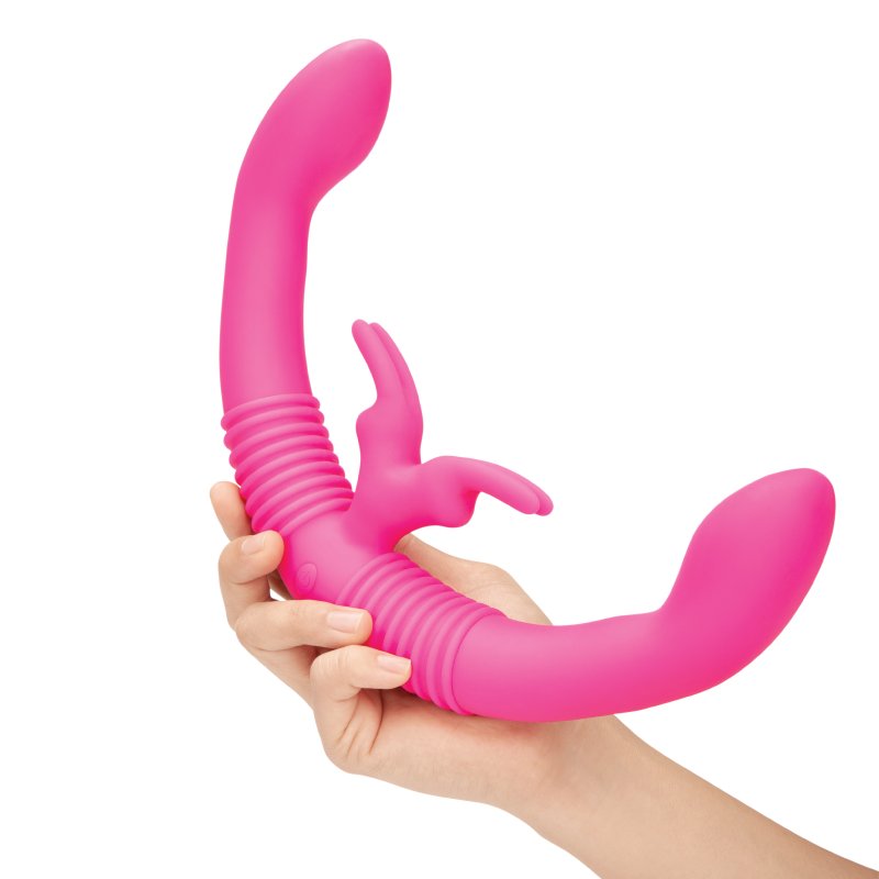A person holds the Together Toy Shared Vibrator for Couples. It shows the very-curved design of this vibrator. | Kinkly Shop
