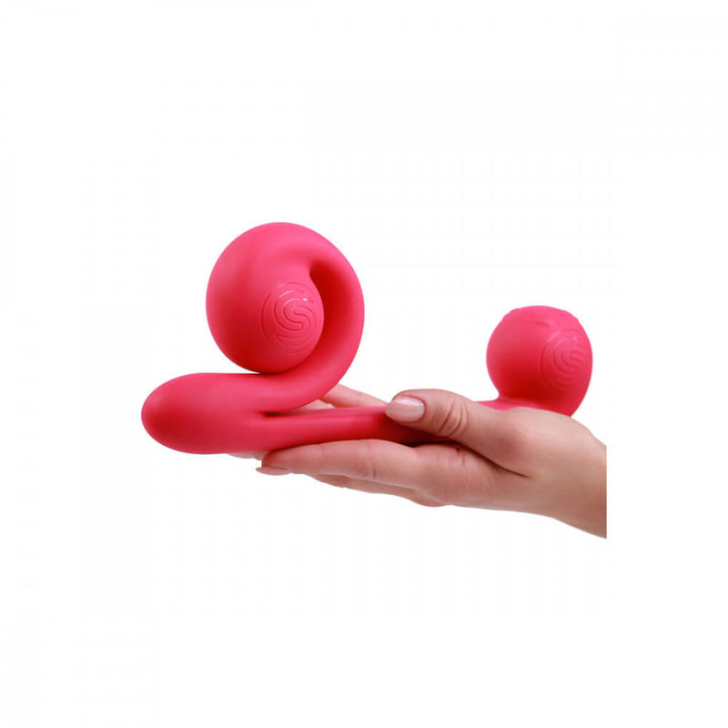 A hand holds the Snail Vibe sex toy. This provides a good size comparison of the vibrator. The vibrator is clearly much larger than the person's palm. | Kinkly Shop