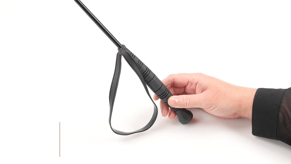 GIF of the Sportsheets Slender Impulse Riding Crop. It shows a person spanking their hand with the tip - then gripping it in their wrist and showing how the wrist strap works. The text says "Curved grip and wrist loop". | Kinkly Shop