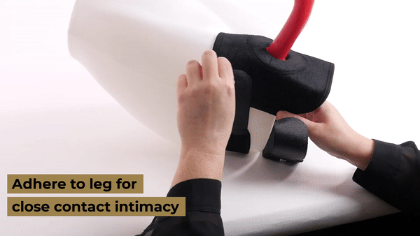 GIF shows a person placing the Sportsheets Thigh Strap On on a mannequin leg. The person adheres the velcro straps together and twists the mannequinn to show the finished set-up. | Kinkly Shop