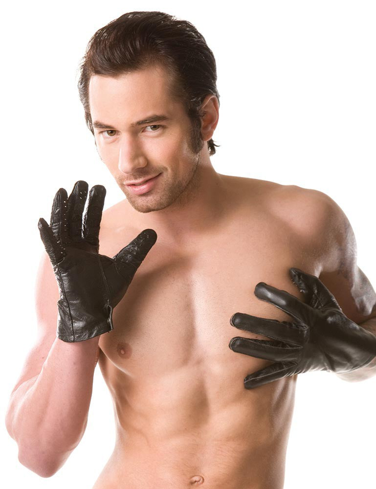 A shirtless person is wearing the Kinklab Vampire Gloves, looking right at the camera. | Kinkly Shop