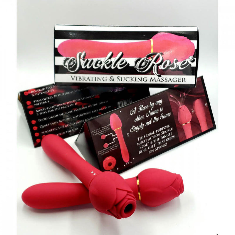 Two Suckle Rose Vibrators sit out in front of the packaging for the Suckle Rose Vibrator. The packaging is very bright in design with black and white stripes along the triangularly-shaped box. | Kinkly Shop