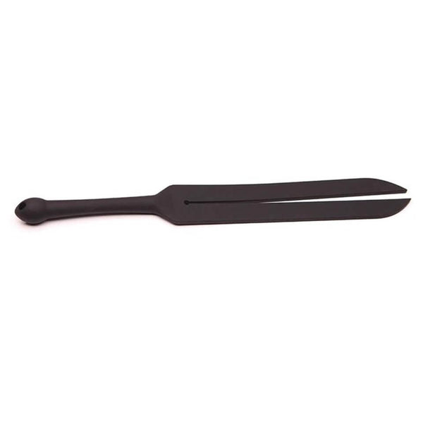 Tantus Tawse Small up against a plain white background. There are not real sharp edges, and the handle and the edges of the Tawse tails are rounded. It has a very streamlined appearance. It looks black and rubbery (It's made from silicone). | Kinkly Shop