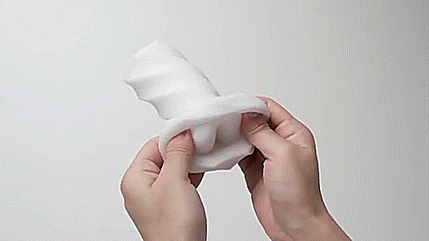 GIF showing two hands turning the Tenga 3D inside out. This shows how it puts the geometric texture inside of the stroker for penis pleasuring. | Kinkly Shop