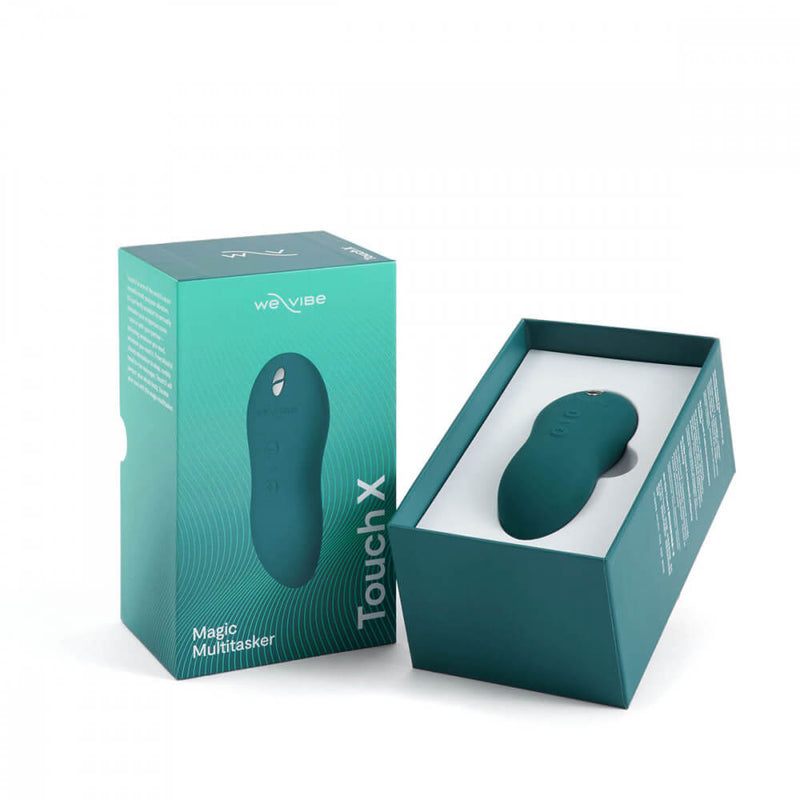 The We-Vibe Touch X sitting within the package while it sits, opened, against a white background. | Kinkly Shop