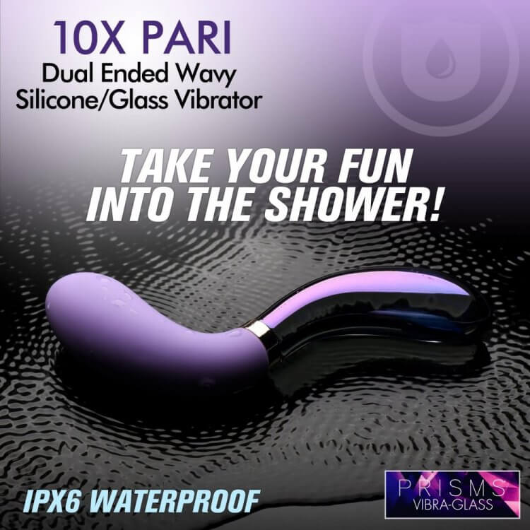 A promotional image for the waterproof design of the XR Brands Prisms Vibra-Glass Pari. The vibrator is lying in a puddle of water with waves throughout the water's surface. The text on the image reads: "10X Pari Dual Ended Wavy Silicone/Glass Vibrator. Take Your Fun into the Shower! IPX6 Waterproof" | Kinkly Shop