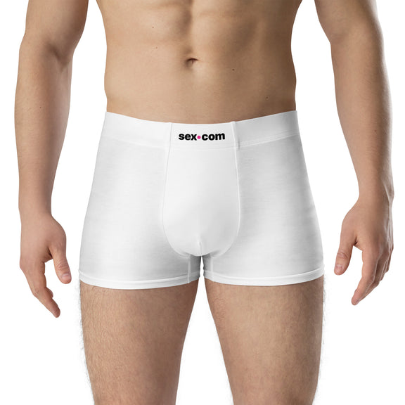 A person wears the Sex.com Boxer Shorts, facing the camera. | Kinkly Shop