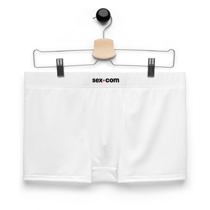 The Sex.com Boxer Shorts boxer brief shorts hang on a clipped hanger. | Kinkly Shop