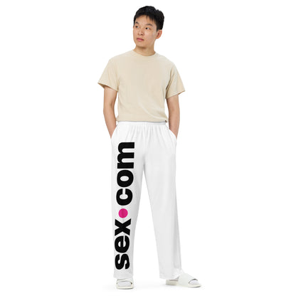 A person wears the Sex.com Unisex Pajamas Pants. They look very comfortable in the pants with a loose fit everywhere except the waist. | Kinkly Shop