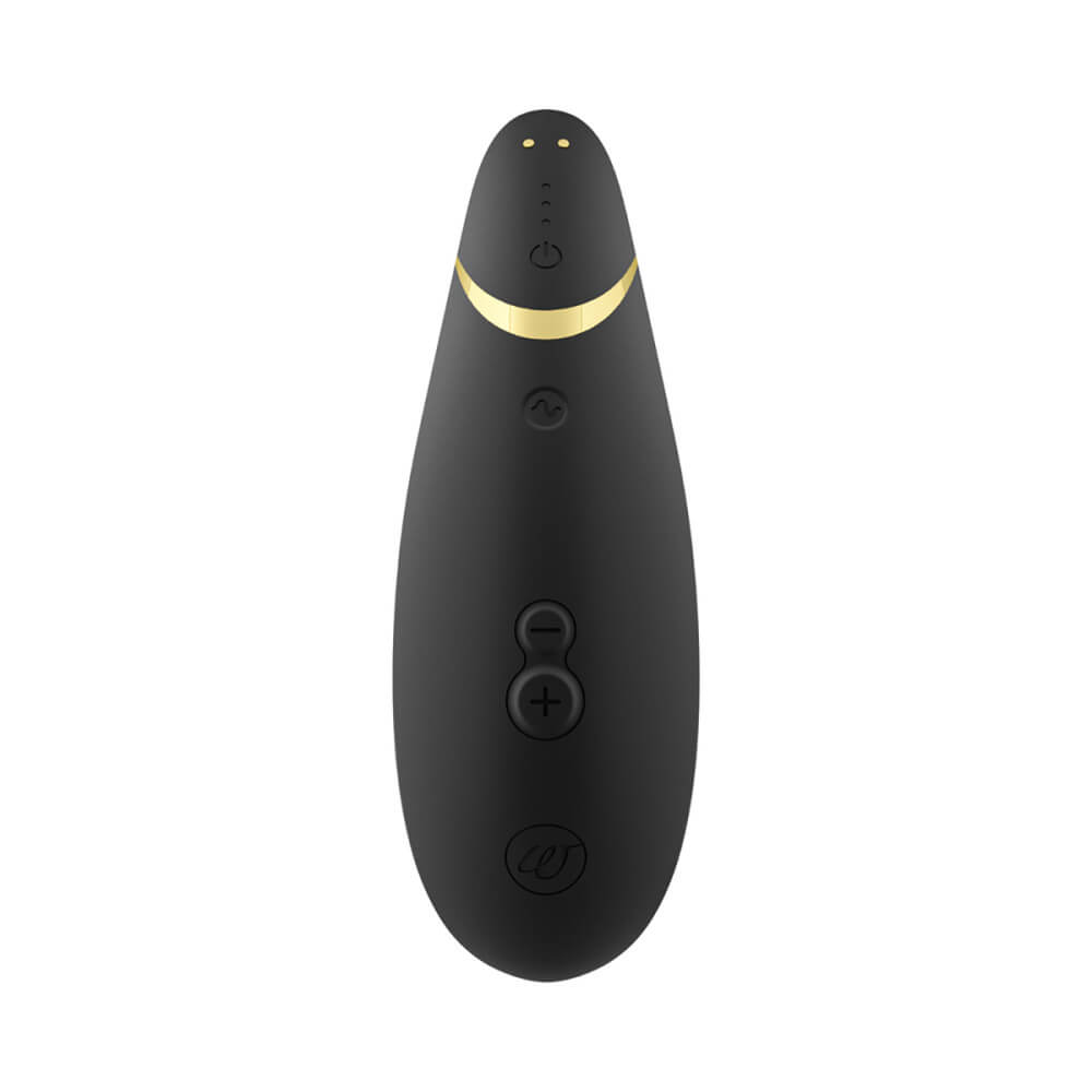 Top-down view of the Womanizer Premium 2 shows all of the buttons on the sex toy. It has four buttons, a spot for illuminating lights, and the two magnetic charging prongs. | Kinkly Shop