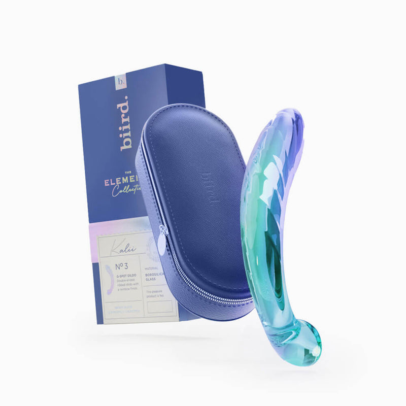 The Biird Kalii g-spot dildo shown in front of the packaging and included zippered storage case. | Kinkly Shop