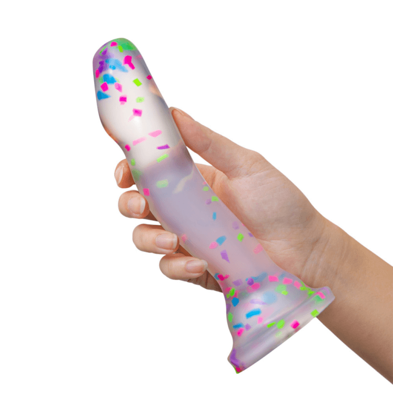 A hand holds the Blush Neo Hanky Panky dildo. It looks surprisingly slender within their hand. It's much longer than the person's extended palm. | Kinkly Shop
