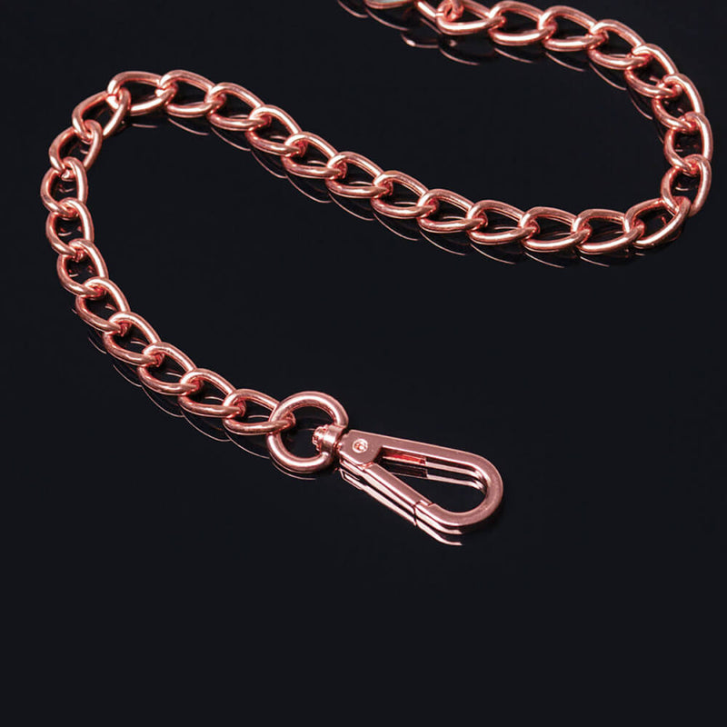 Close-up of the clip on the end of the leash. It's in a rose gold coloration, and it looks like it would slip easily onto any O-ring or D-ring when you're ready to latch onto a bondage item. | Kinkly Shop