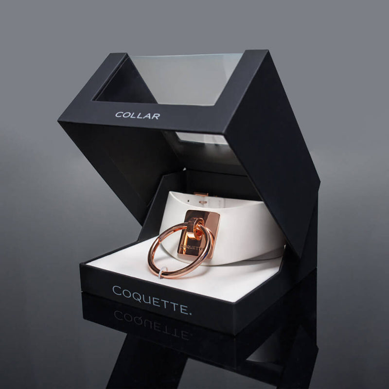 The Coquette Pleasure Collar within its packaging. It looks very luxurious. | Kinkly Shop