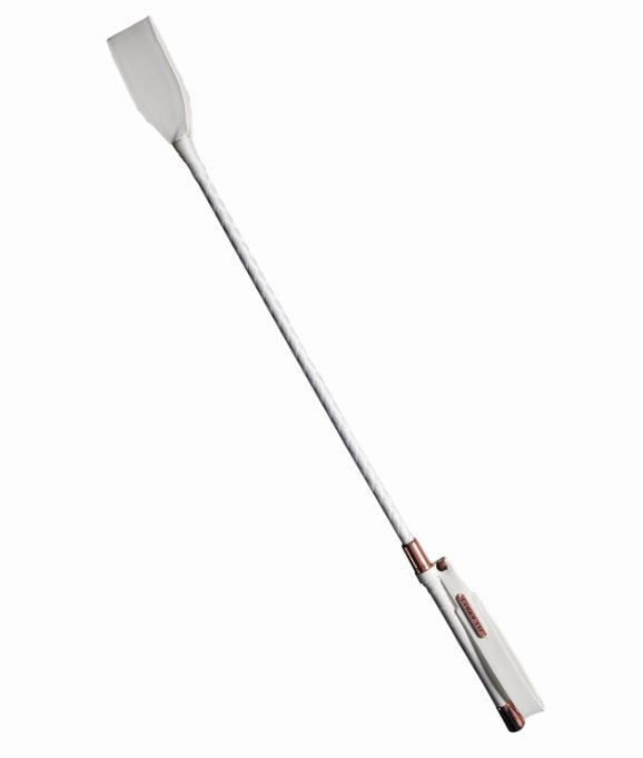 Coquette White and Rose Gold Riding Crop up against a white background. The majority of the crop is white in color from the handle to the stem to the tip. There are rose gold metal accents near the handle. | Kinkly Shop