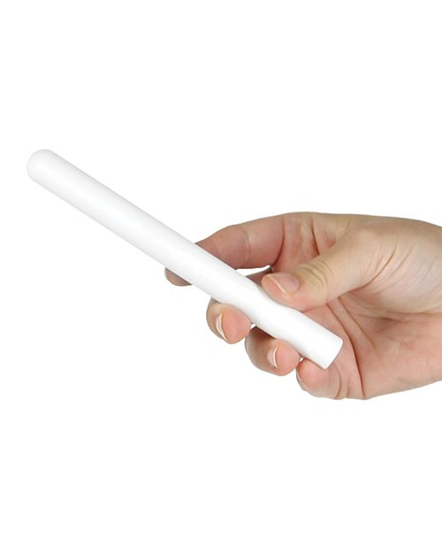 A person grips the Cutie Pies Dry Stick. It looks a bit longer and thicker than a standard pen. | Kinkly Shop
