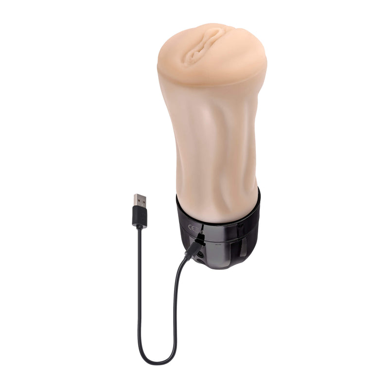 Evolved Tight Lipped with the charging cable plugged into the base of the penis stroker. The charging cable is one that plugs into the base of the toy itself with the USB end of the cord. | Kinkly Shop