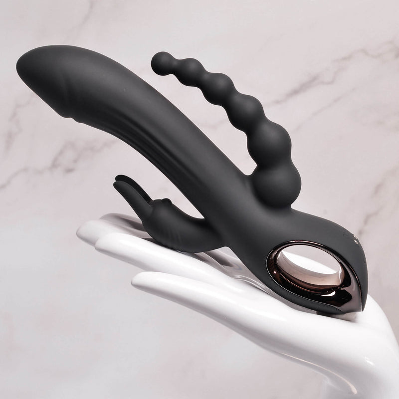 A mannequin hand holds the Evolved Trifecta upright. It is a long, smooth toy, and it extends well past the end of the mannequin's fingers. It looks creamy smooth to the touch. | Kinkly Shop