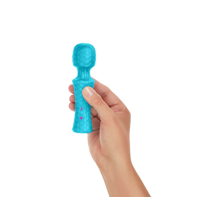 A hand holds the FemmeFunn Ultra Wand Mini in Turquoise against a white background. The wand massager looks surprisingly short in height, and it is barely longer than the person's hand. It looks adorably tiny. | Kinkly Shop